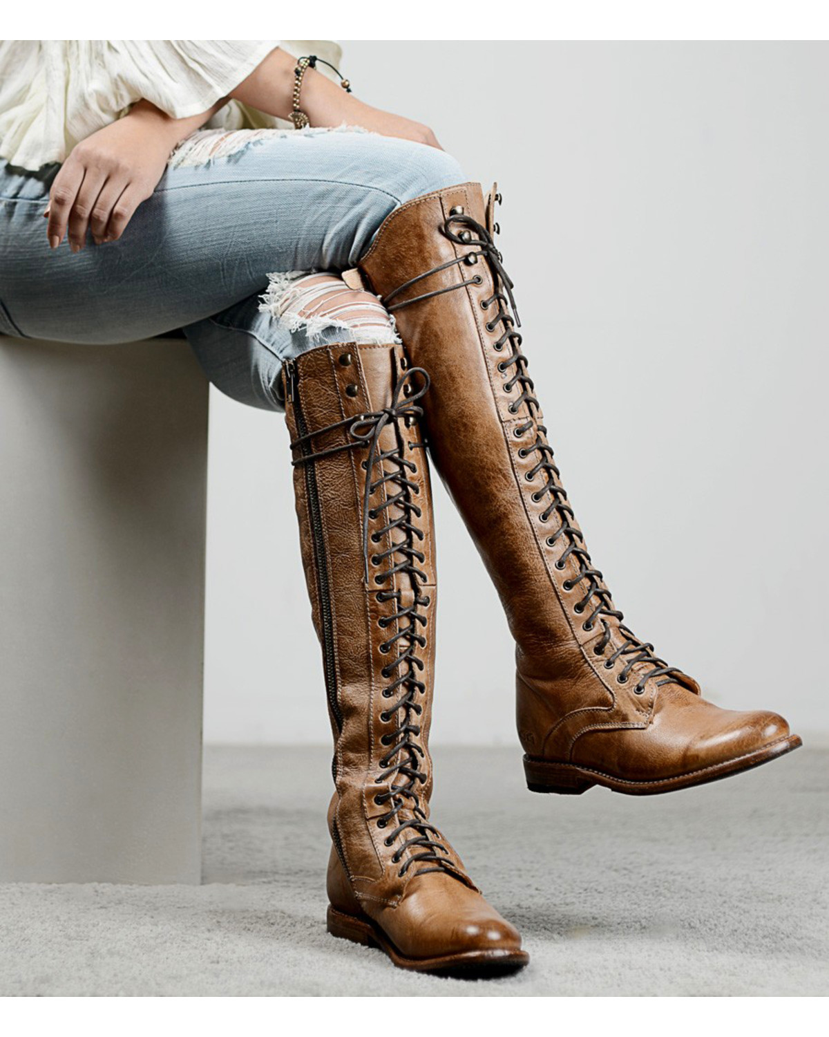 brown boots with shoelaces