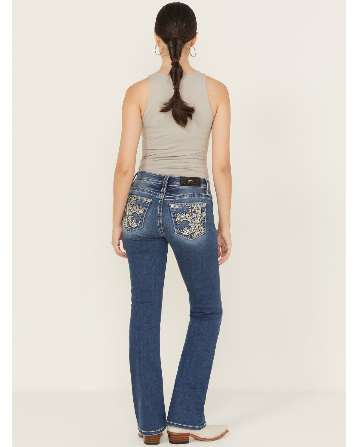 Image #1 - Miss Me Women's Medium Wash Mid Rise Fleur de Lis Pocket Bootcut Stretch Denim Jeans, Medium Wash, hi-res