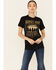Image #1 - Kerusso Women's Heroes Ride Off Into The West Graphic Short Sleeve Tee , Black, hi-res