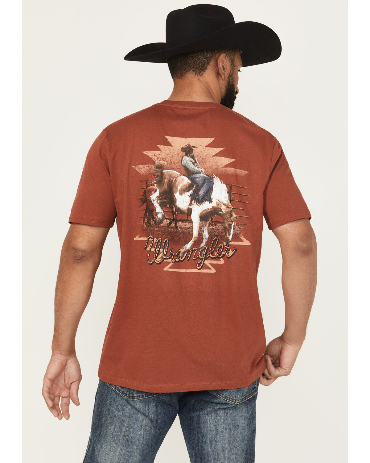 Image #1 - Wrangler Men's Boot Barn Exclusive Bucking Bronco Short Sleeve Graphic Tee, Rust Copper, hi-res