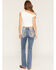 Image #1 - Miss Me Women's Medium Wash Mid Rise Fleur de Lis Pocket Bootcut Stretch Denim Jeans, Medium Wash, hi-res