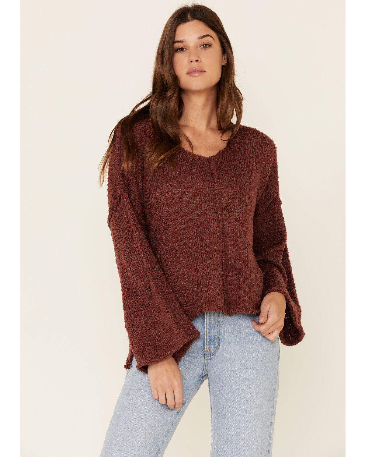 red sweater with bell sleeves