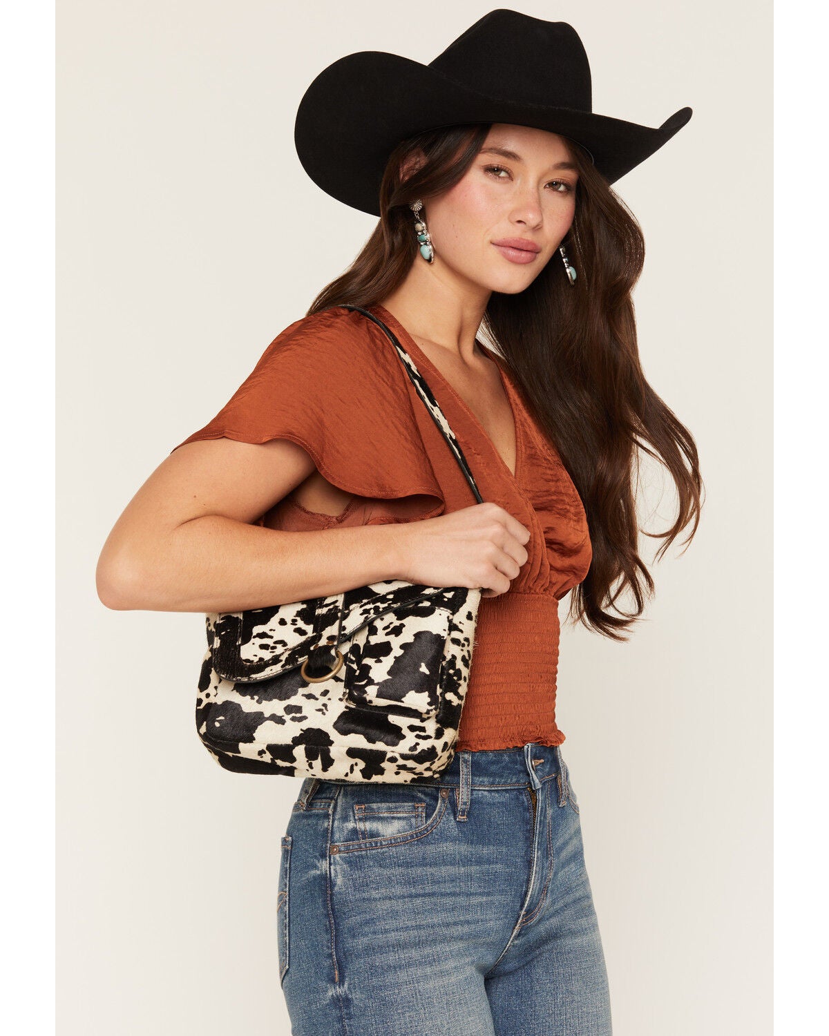 Image #1 - Shyanne Women's Sorrel Cow Print Shoulder Saddle Bag Purse, Black, hi-res