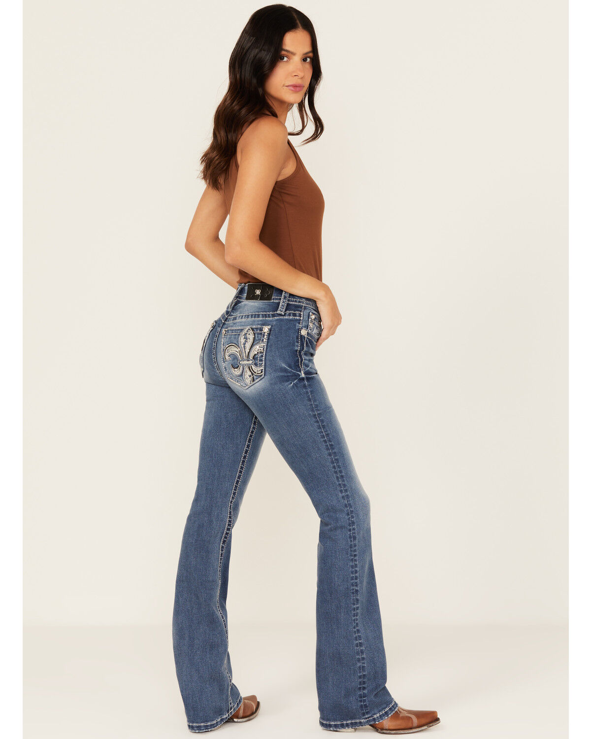 Image #1 - Miss Me Women's Medium Wash Mid Rise Fleur de Lis Pocket Bootcut Stretch Denim Jeans, Medium Wash, hi-res
