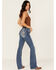 Image #1 - Miss Me Women's Medium Wash Mid Rise Fleur de Lis Pocket Bootcut Stretch Denim Jeans, Medium Wash, hi-res