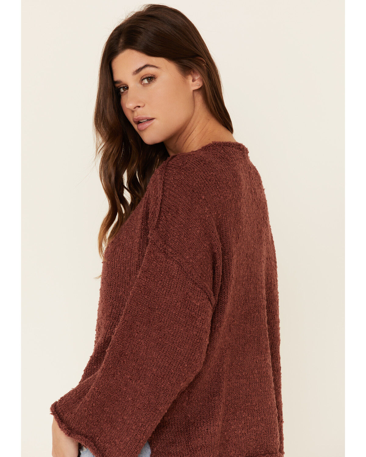 red sweater with bell sleeves