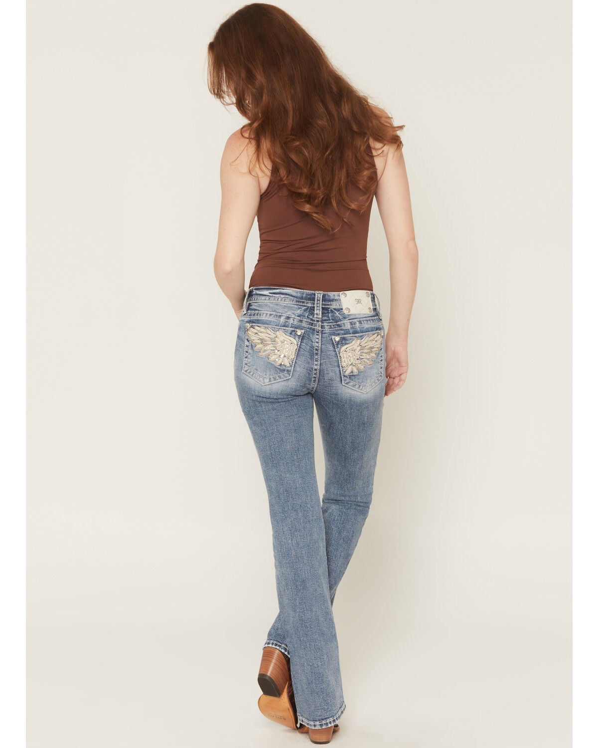 Image #1 - Miss Me Women's Medium Wash Mid Rise Logo Pocket Bootcut Stretch Denim Jeans, Medium Wash, hi-res