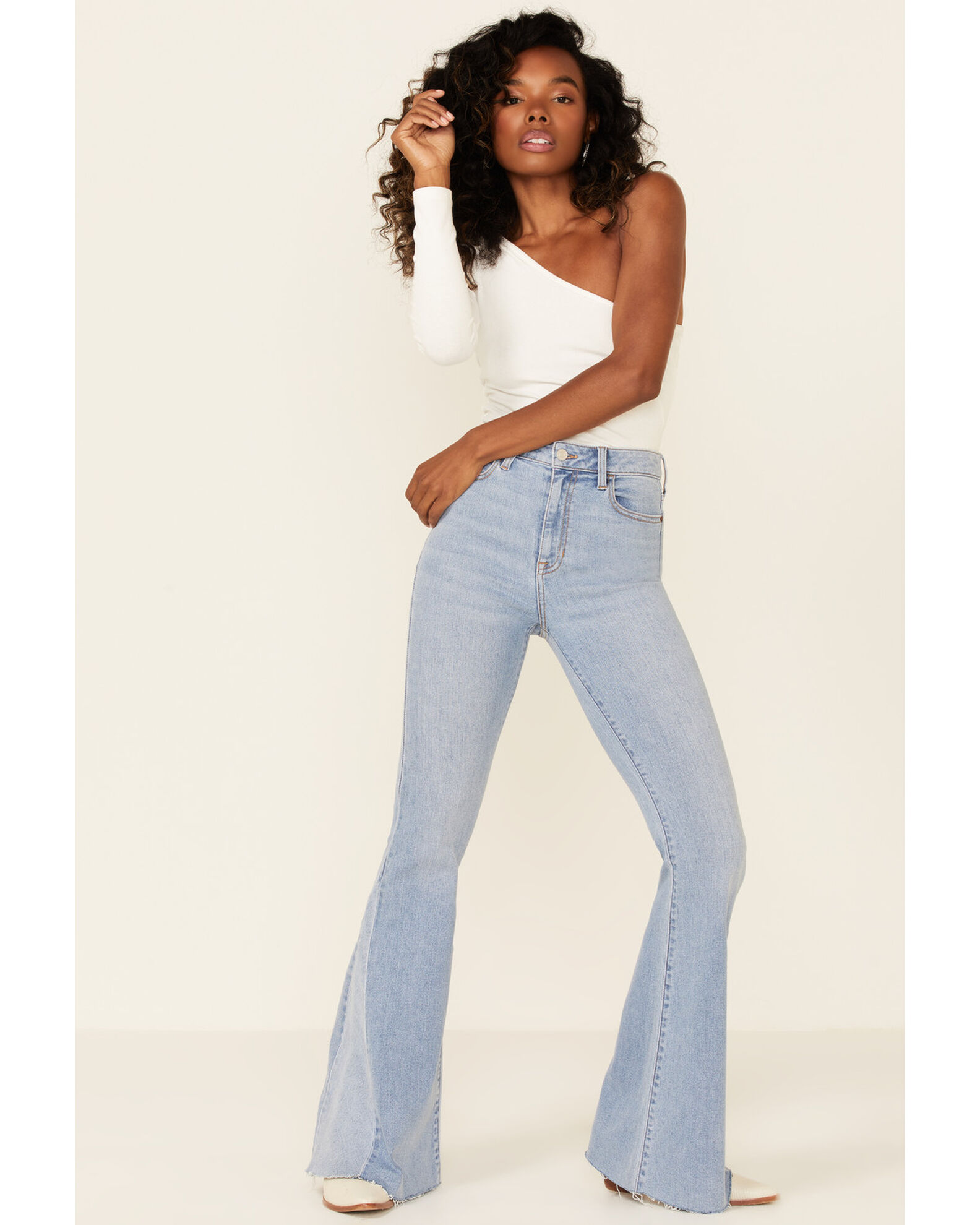 Light wash on sale frayed hem jeans