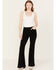 Image #1 - Shyanne Women's High Rise Destructed Super Flare Stretch Jeans, Black, hi-res