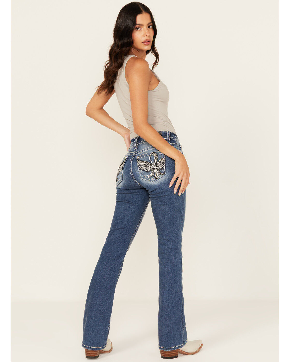 Image #1 - Miss Me Women's Medium Wash Mid Rise Fleur de Lis Pocket Bootcut Stretch Denim Jeans, Medium Wash, hi-res